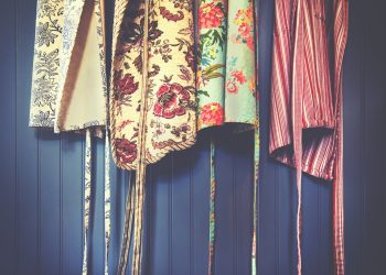 four assorted-color aprons