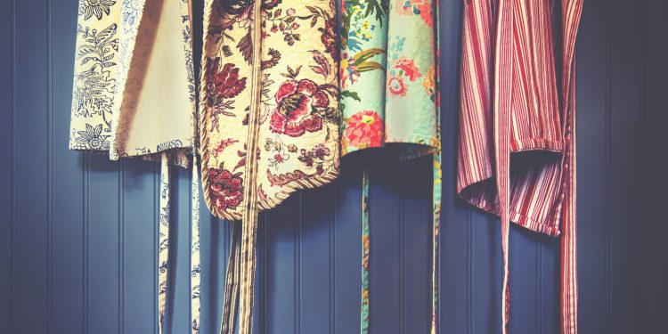 four assorted-color aprons