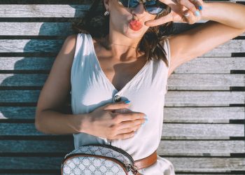 woman in white tank top wearing sunglasses