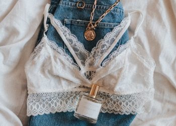 blue denim jeans with gold necklace