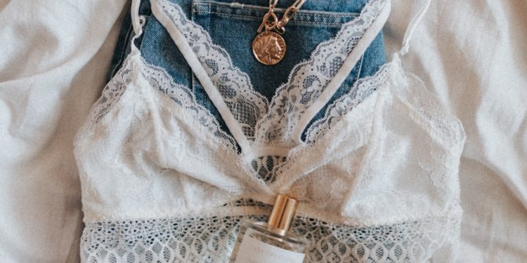 blue denim jeans with gold necklace